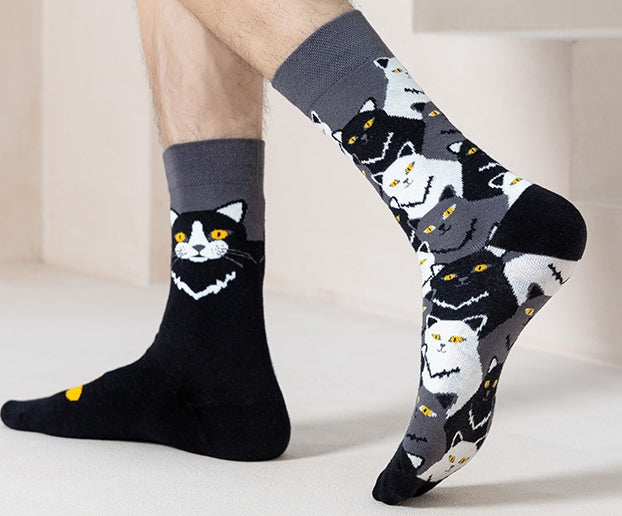 Black cat socks worn on feet